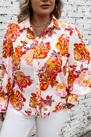 Blouse with blouson sleeves in a bold floral print, button-up front, and classic collar.