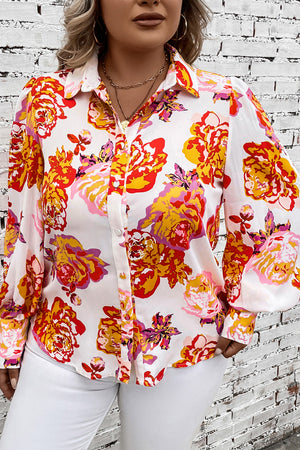Blouse with blouson sleeves in a bold floral print, button-up front, and classic collar.