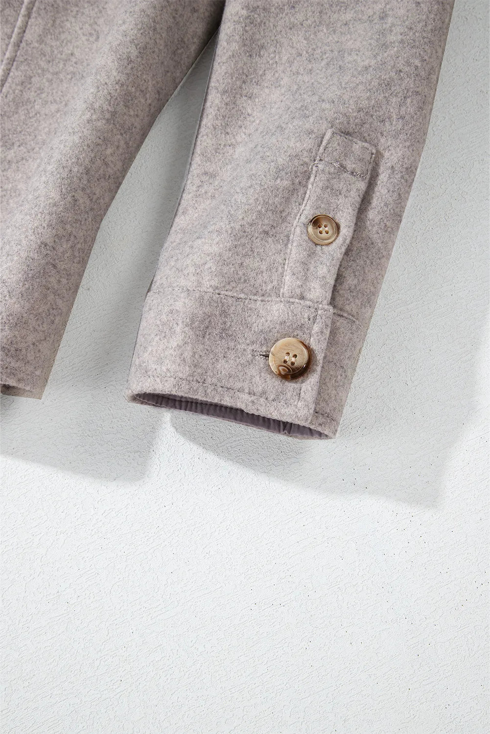 Fleece-textured utility shirt jacket in Dust Storm with buttoned cuffs and a buttoned pocket detail.