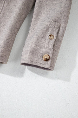Fleece-textured utility shirt jacket in Dust Storm with buttoned cuffs and a buttoned pocket detail.