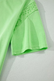 Lime green cotton two-piece set with embroidered eyelet detail on sleeve and shoulder.