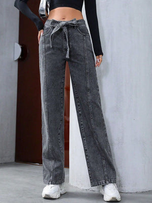 Belted wide-leg washed denim trousers in dark gray with a tie waist and seam detail.