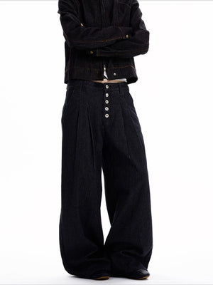 Men's black high-waisted wide leg jeans with button fly and vertical pinstripe detail.