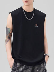 Men's black oversized cotton tank top with small chest logo detail.