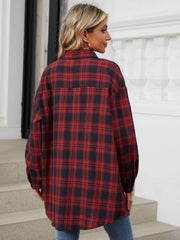 Oversized red and black plaid shacket with buttoned cuffs and collar.