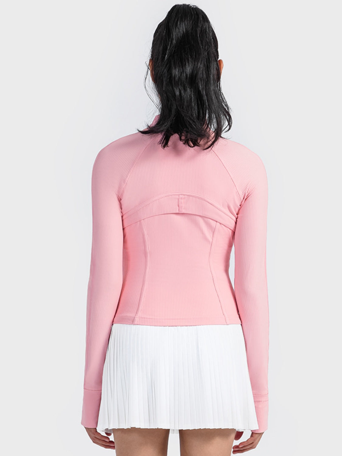 Ribbed performance zip-up track jacket in carnation pink with thumbholes.