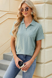 Light green textured polo shirt with V-neck and pocket detail