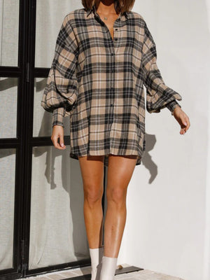 Plaid oversized shirt in brown with balloon sleeves and a collared neckline.