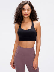 Black sports bra with crisscross back detail and scoop neckline.