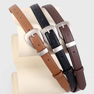 Sleek cowhide leather belts in coffee brown, black, and brown with silver buckles.