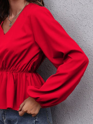 Deep red peplum blouse with V-neck and balloon sleeves