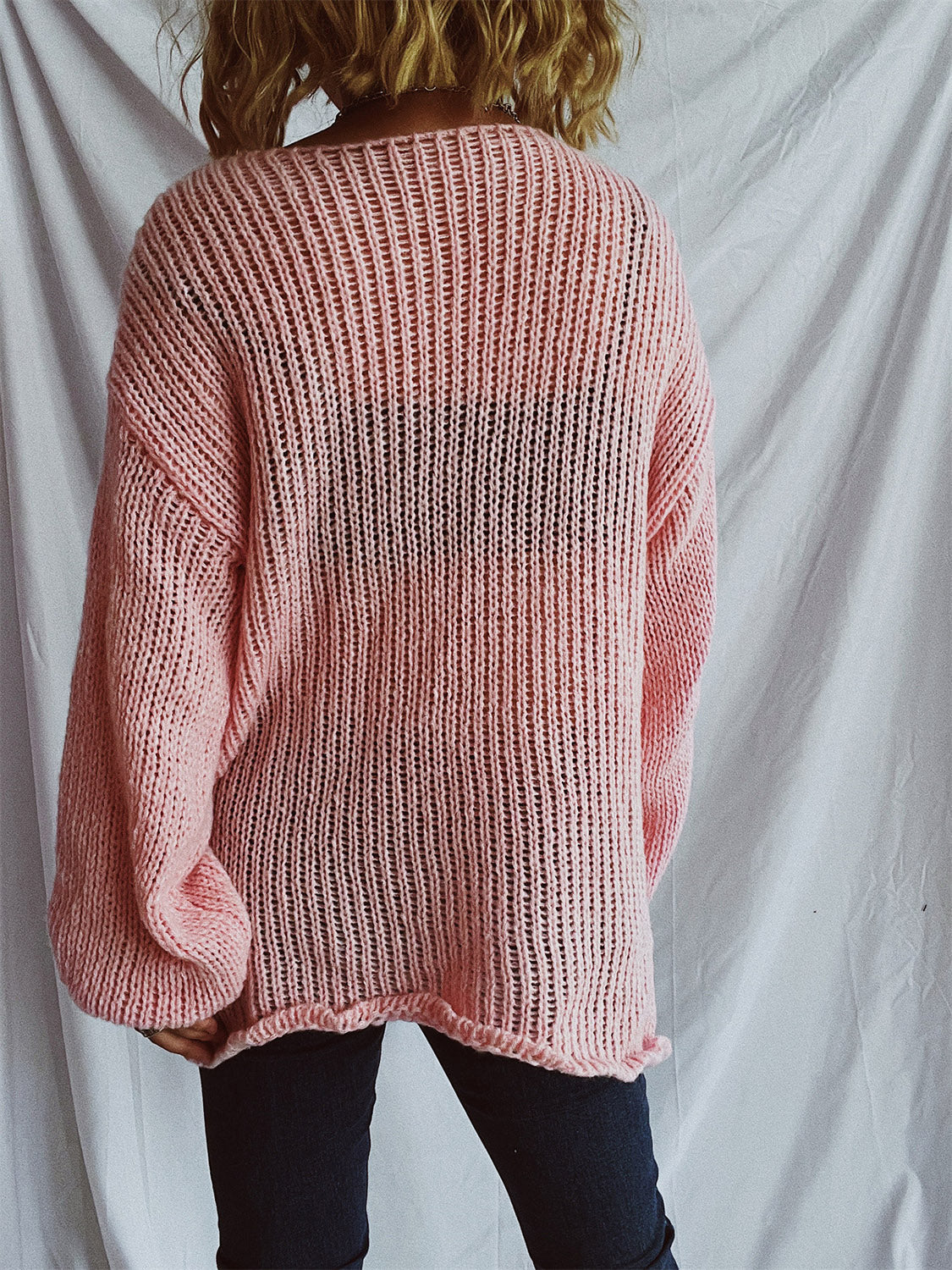Blush pink open-knit slouchy boatneck pullover sweater with ribbed detail.