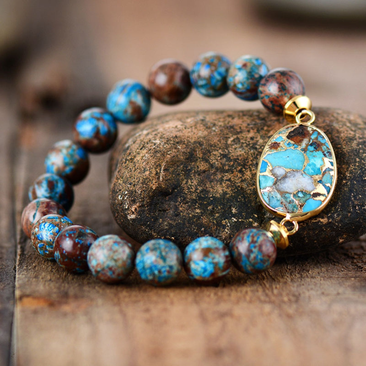 Verdant Stone & Orb Bracelet in gold with aqua and brown beads, featuring an oval stone pendant.