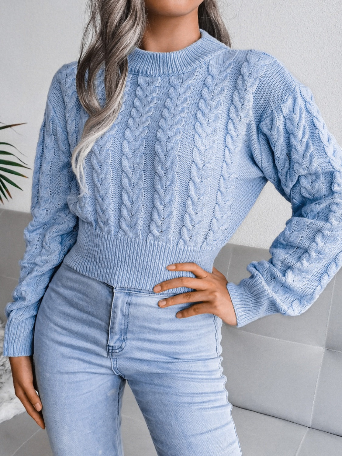 Light Blue cable knit cropped mock neck sweater with textured sleeves