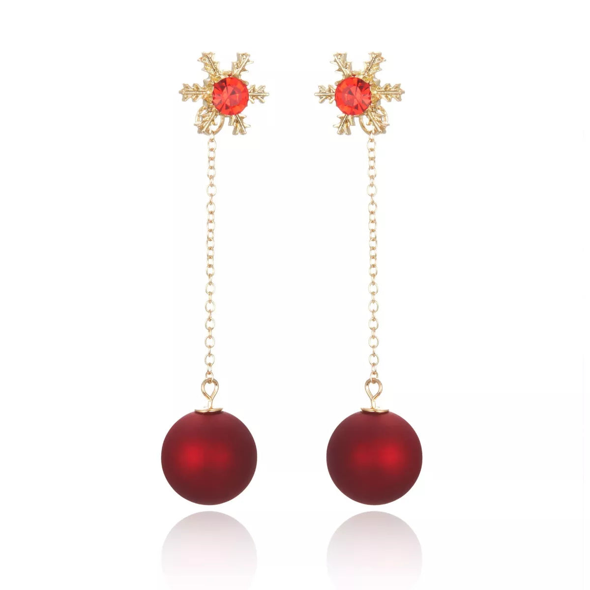 Deep red snowflake drop earrings with gold chain and matte red ball charms.
