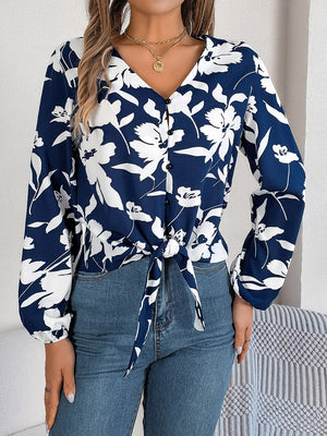 Navy floral knot-front blouse with v-neck and button detail