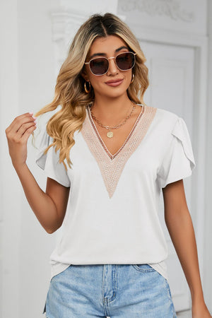 White V-neck blouse with lace trim and flutter sleeves