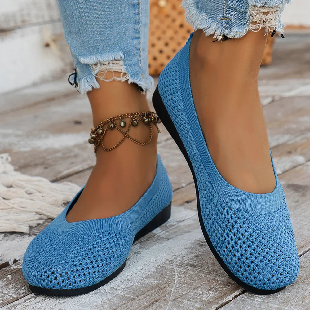 Sky blue breathable knit ballet flats with a textured weave and low heel.
