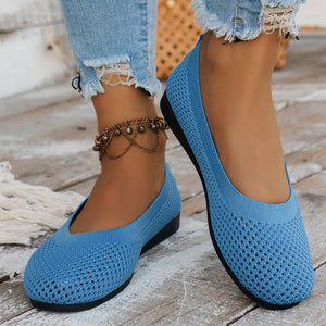 Sky blue breathable knit ballet flats with a textured weave and low heel.