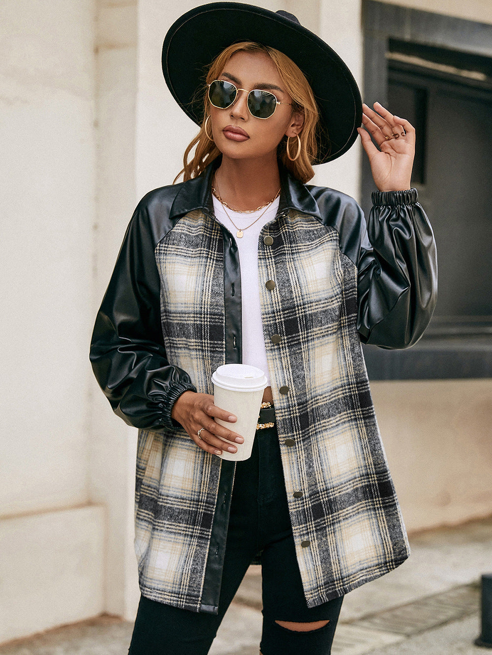 Plaid & faux leather raglan shacket with buttoned front and elastic cuffs.