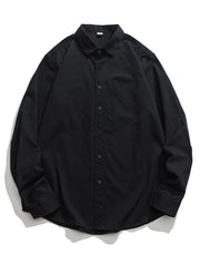 Black cotton button-down shirt with a chest pocket and long sleeves.