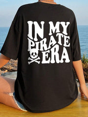 Black oversized graphic tee with "IN MY PIRATE ERA" text and skull graphic