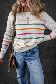 White ribbed knit pullover sweater with colorful stripes and crew neck.