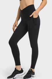 Black performance leggings with sculpted waistband and side pockets.