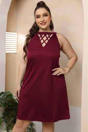 Wine trapeze mini dress with crisscross halter neckline and sleeveless cut.