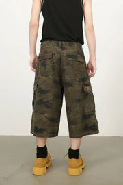 Camo culotte cargo shorts in green camouflage with multiple pockets.
