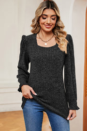 Black ribbed tee with square neck, puff sleeves, and ruffled cuffs.