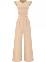 Apricot ruffled cap sleeve maternity top with ruched waist and wide leg pants.