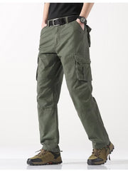 Men's army green relaxed fit cargo pants with button flap pockets and stretch fabric.