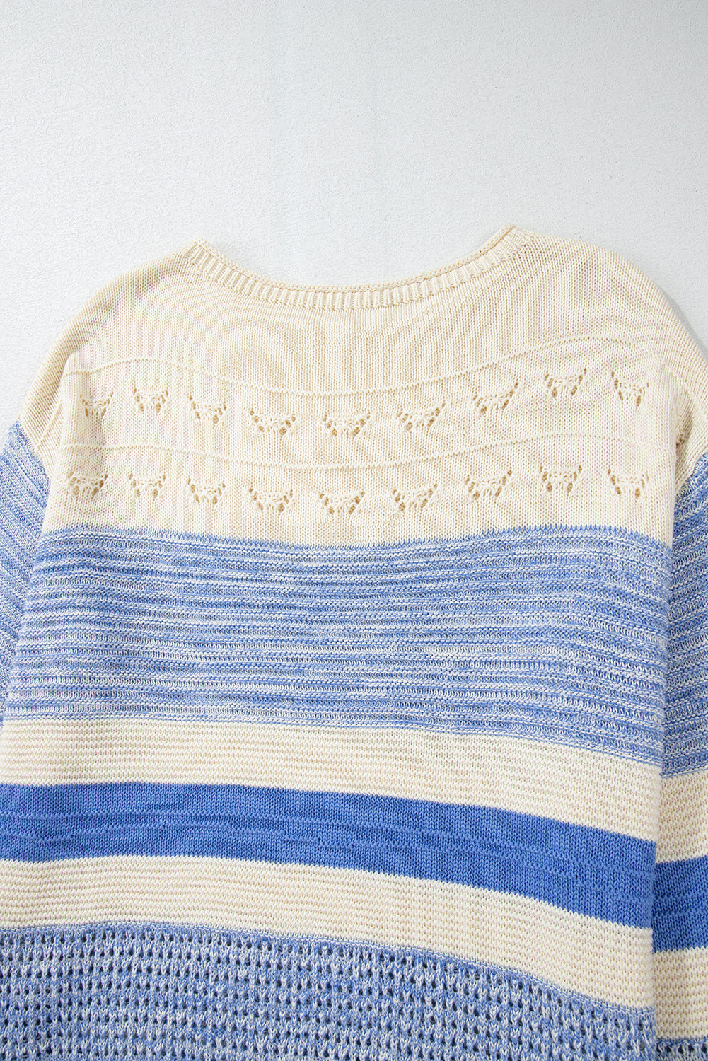 Light blue striped knit sweater with eyelet yoke detail