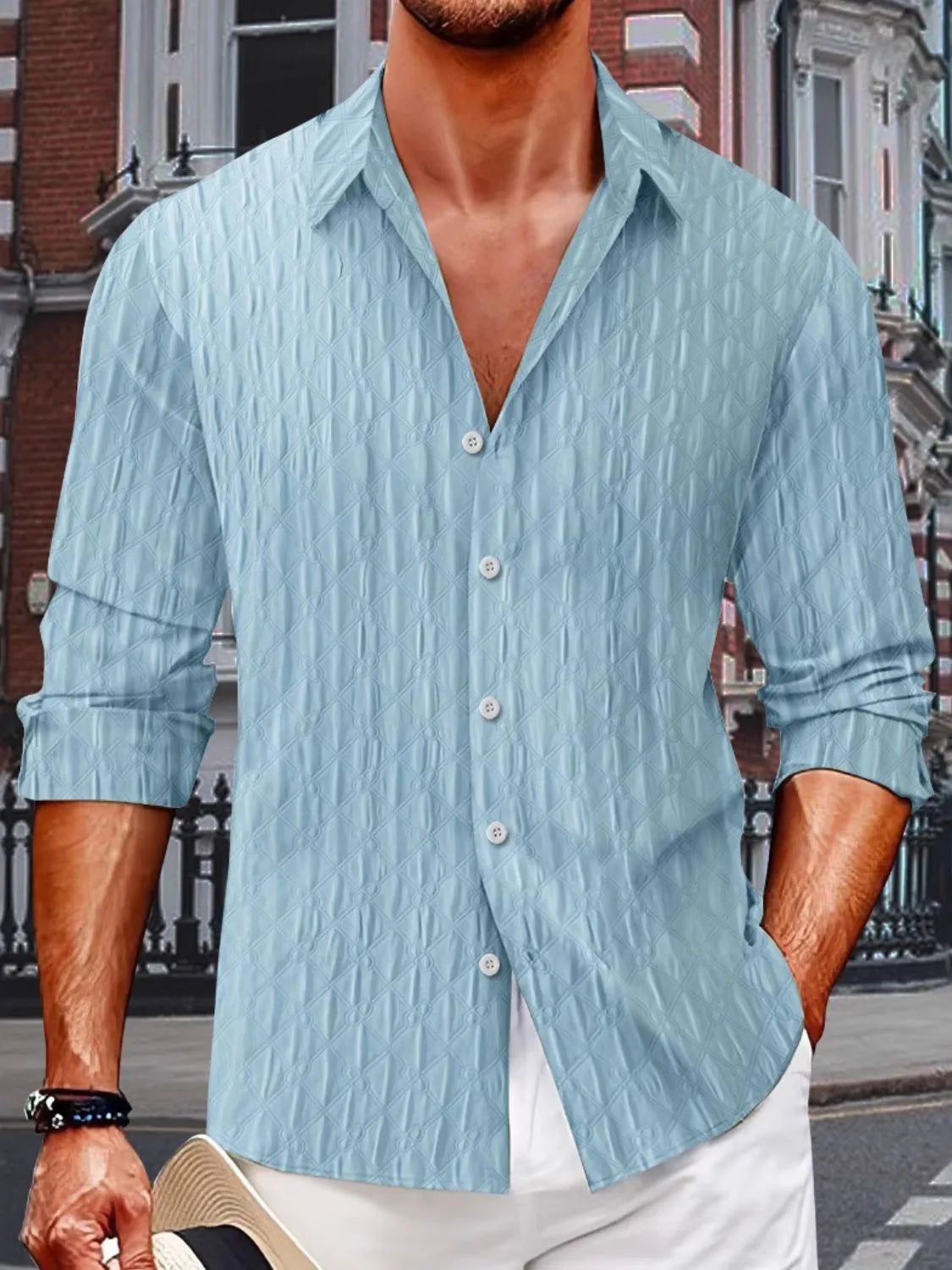 Light blue textured weave relaxed fit button-down shirt with a collared neckline.
