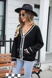 Black acrylic cardigan with white trim and pockets, button front, v-neck