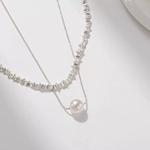 Elegant double layered silver necklace with a single pearl accent