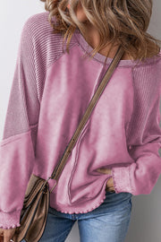 Dusty Pink waffle knit raglan sweatshirt with contrast sleeves and raw hem detail.