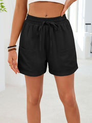 Black casual shorts with elastic waist, drawstring, and pockets.