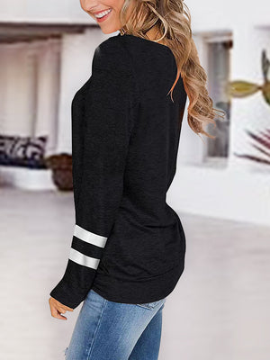 Black long sleeve raglan v-neck top with white varsity stripes on sleeves.