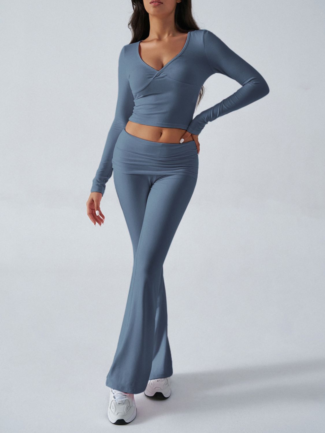 Dusty blue cross-front long sleeve crop top and flare lounge pants set.