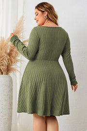Matcha green ribbed fit-and-flare midi dress with long sleeves and tie front detail.