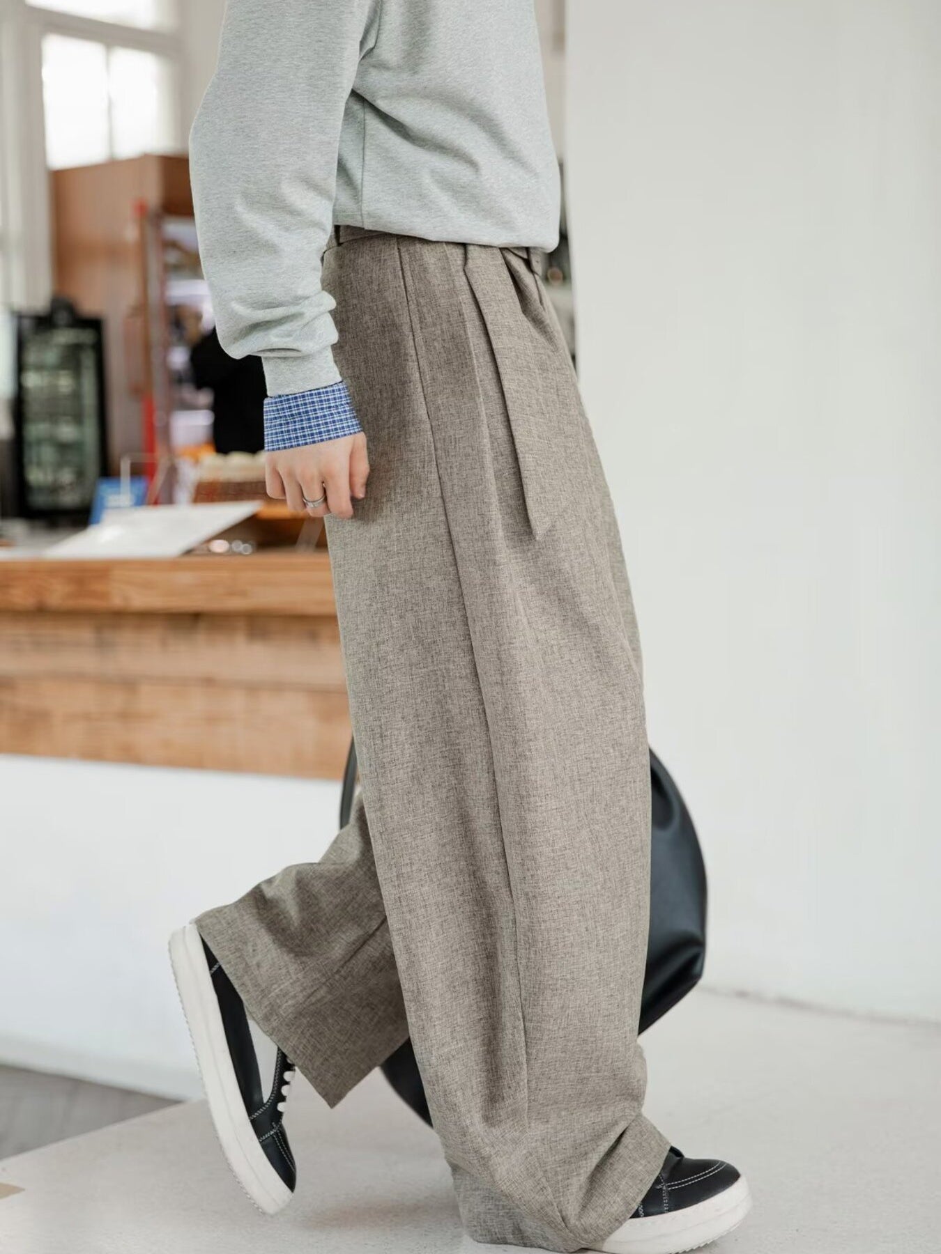 Men's wide leg trousers in taupe with a tie waist and pockets.
