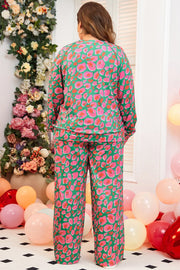 Botanical leopard print loungewear set in green with pink and coral spots, long sleeves, and wide-leg pants.