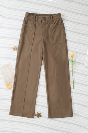 Seamed front wide leg trousers in caramel with buttoned waist and patch pockets.