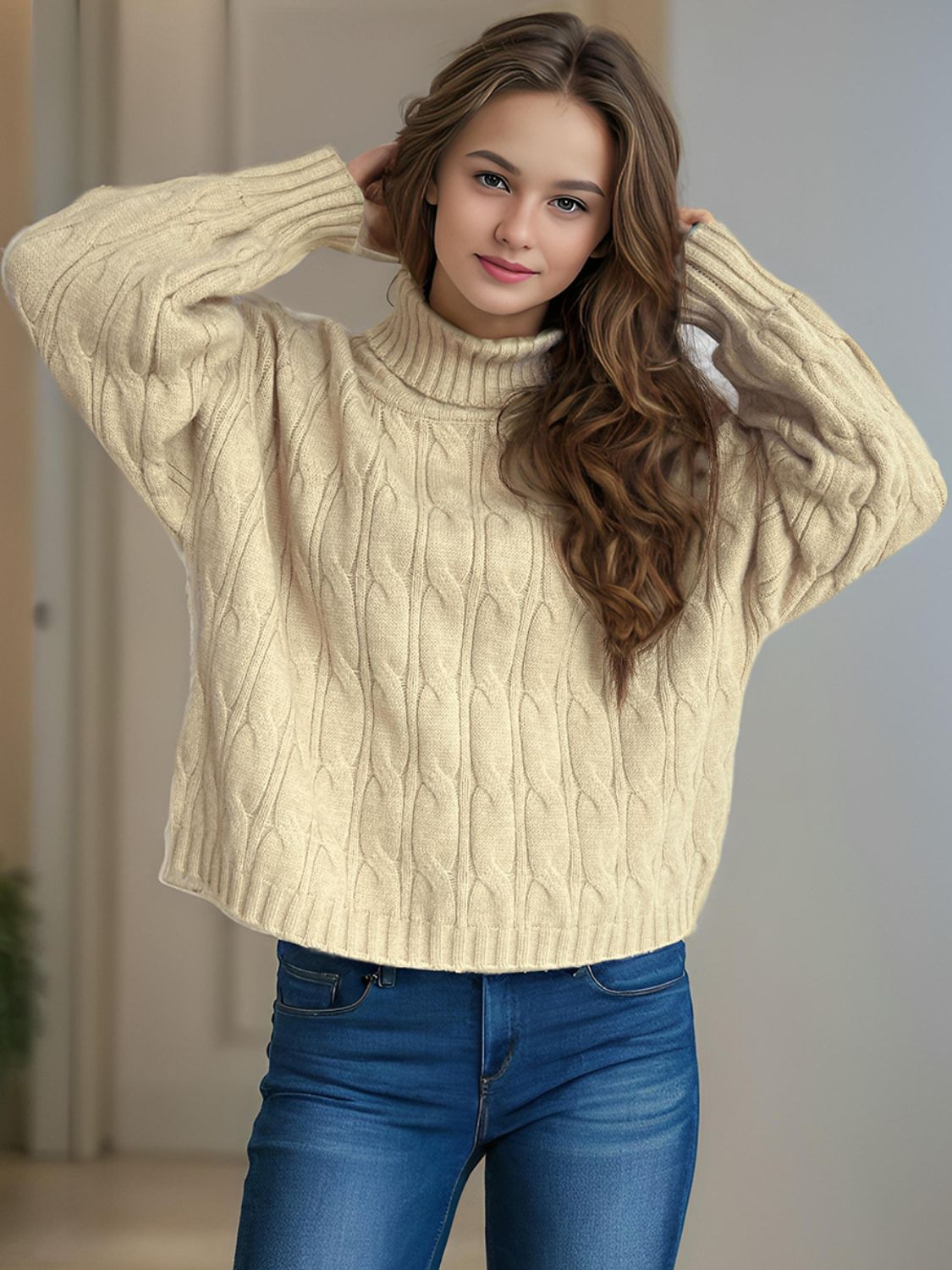 Oversized cable knit turtleneck pullover in cream acrylic with a relaxed fit.