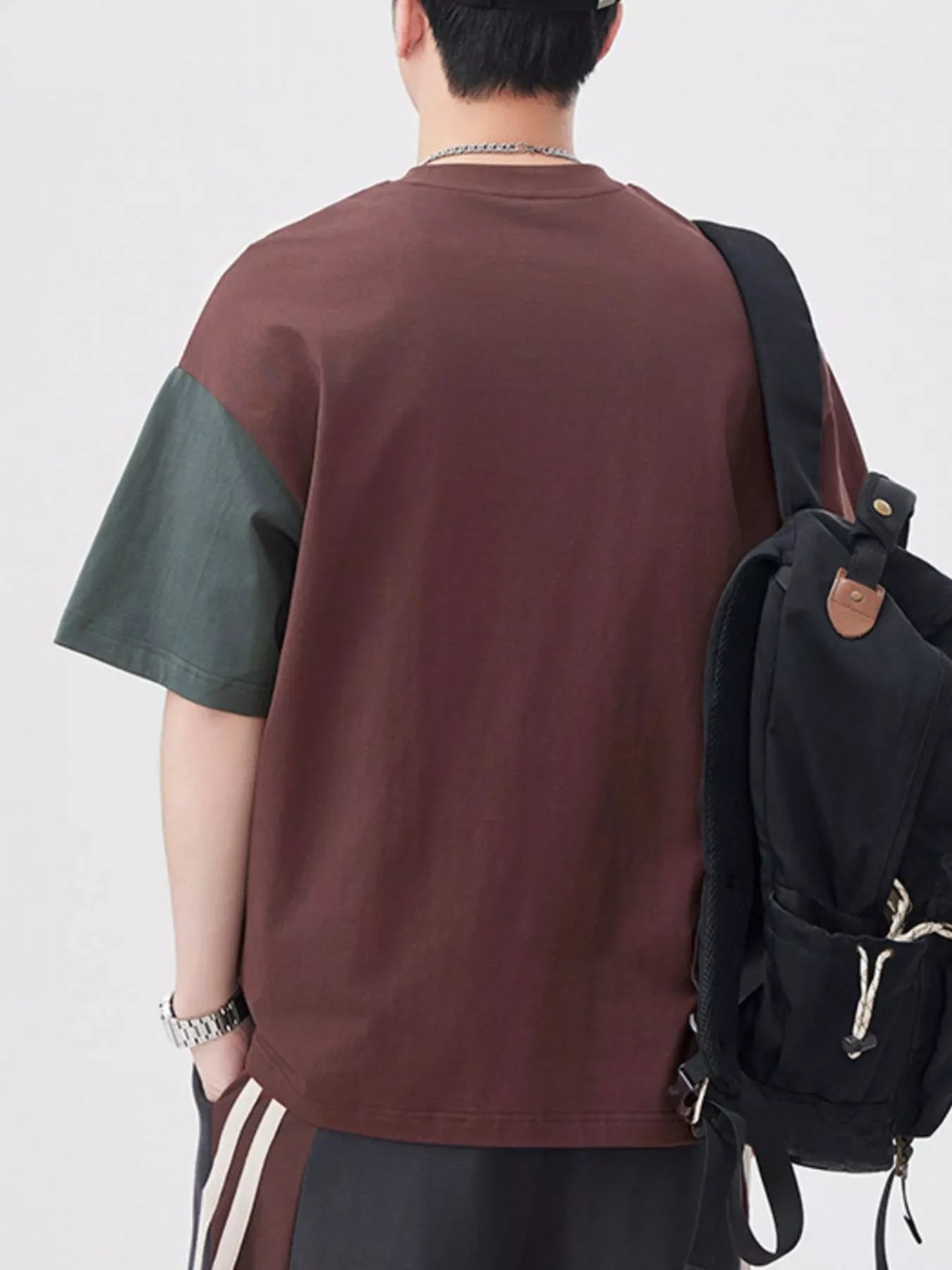 Oversized cotton t-shirt in coffee brown with dark gray color block sleeves.