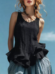 Black sleeveless tank top with ruffled hem detail