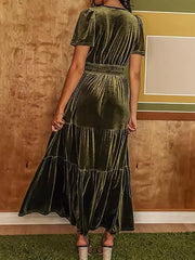 Army green velvet maxi dress with short sleeves, ruched bodice, elastic waist, and tiered skirt.