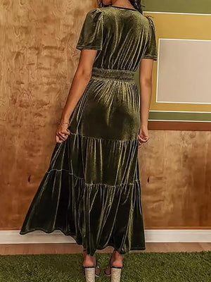 Army green velvet maxi dress with short sleeves, ruched bodice, elastic waist, and tiered skirt.